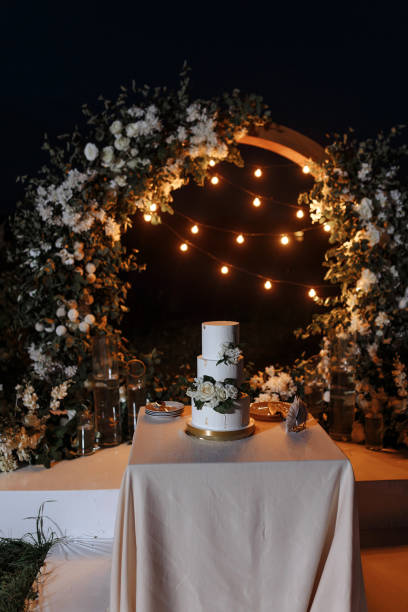 istock Wedding cake on the background of a garland 1436761444