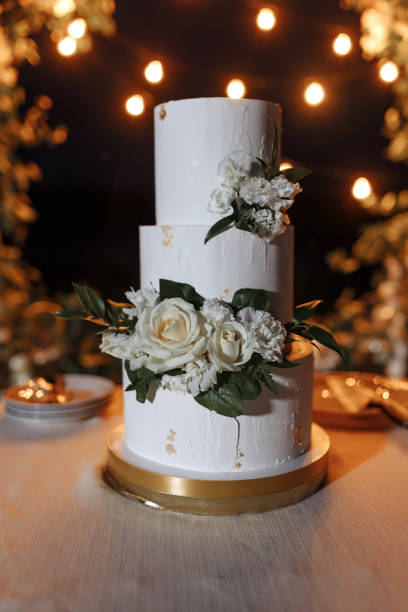 istock Wedding cake on the background of a garland 1436761454