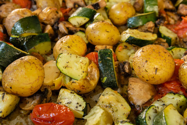 Close up of oven roasted vegetables on a baking tray
