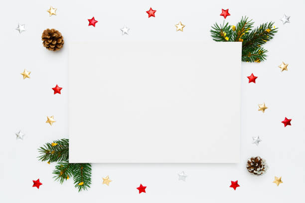 istock Christmas, New Year holiday layout with copy space for text. Blank white paper in frame of natural fir tree branches, pinecones and decorations on white flat lay background. 1436766177