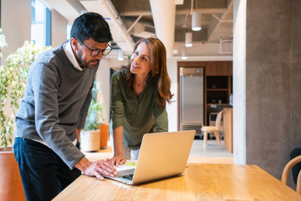 istock Business people sharing ideas at the office 1436767568