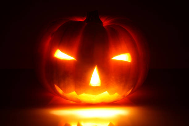 Halloween pumpkin (Jack-o'-lantern) on black background