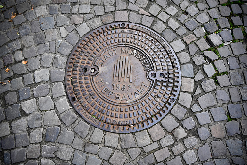 Münster, Germany, October 18, 2022 - Sewer cover of the university city of Münster