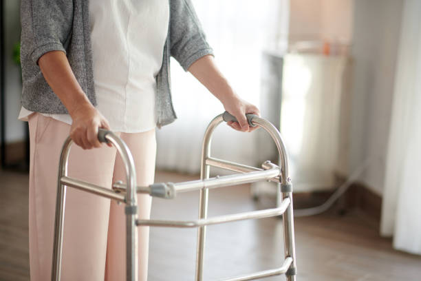 istock Senior Woman Leaning on Walker 1436774436