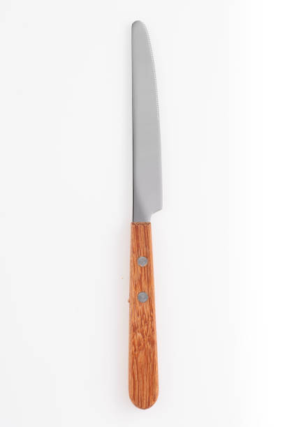 istock Wooden silver knife isolated on white background. Studio shot. 1436774746