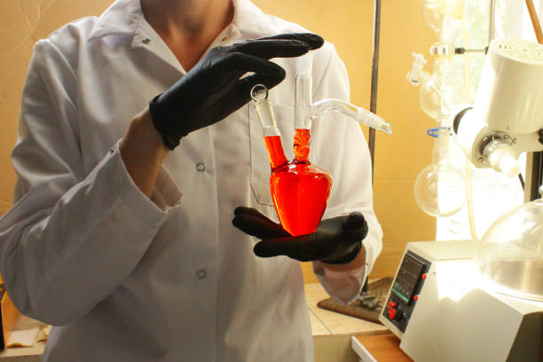 istock a chemist with a heart-shaped flask. analytical, research work in the laboratory, syntheses 1436775261