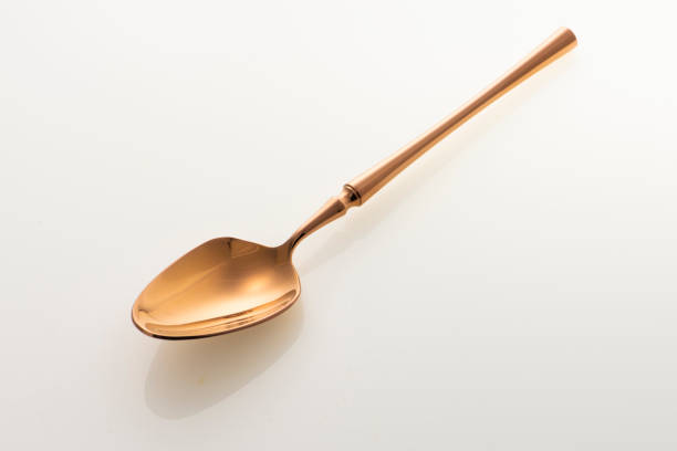 istock Golden spoon isolated on white background. Studio shot. 1436775870