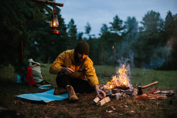 istock A lonely wanderer is having dinner in the mountains by a campfire. 1436777045