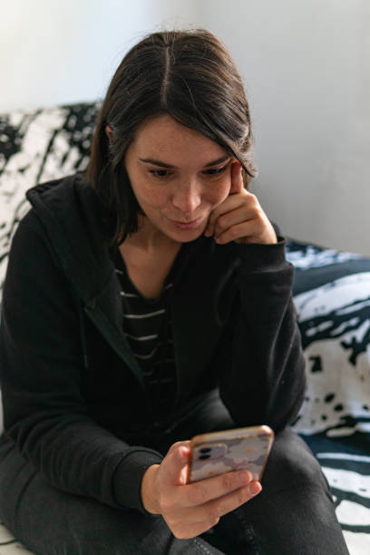 istock Mid 30's woman having a video call with a friend 1436780802