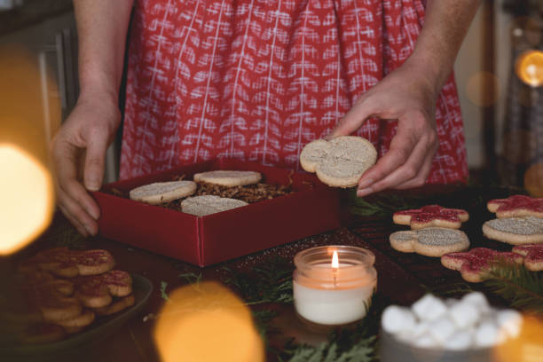 istock Woman baking Christmas cookies for presents 1436780926
