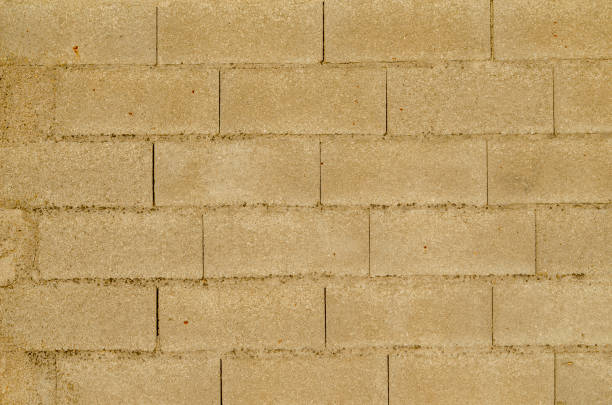 istock detail of a cement block wall, construction background 1436782954