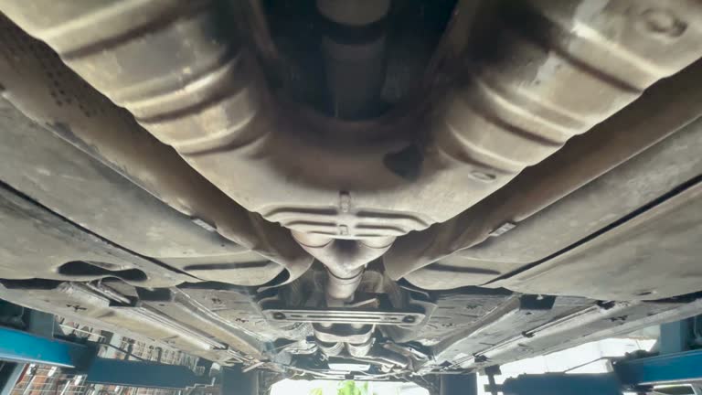 Exhaust of a car on bridge at auto repair shop