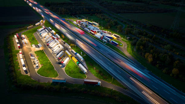istock Highway and rest area at dusk - aerial view 1436788056
