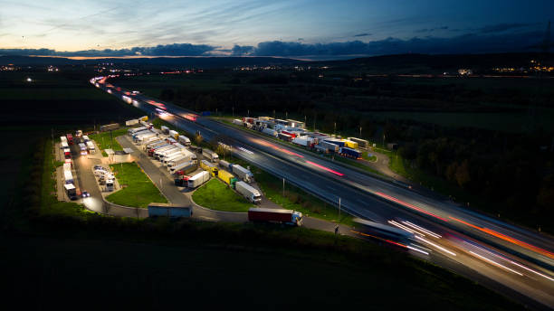 istock Highway and rest area at dusk - aerial view 1436788070