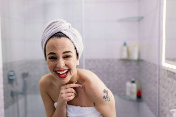 istock Woman laughing in bathroom 1436789049