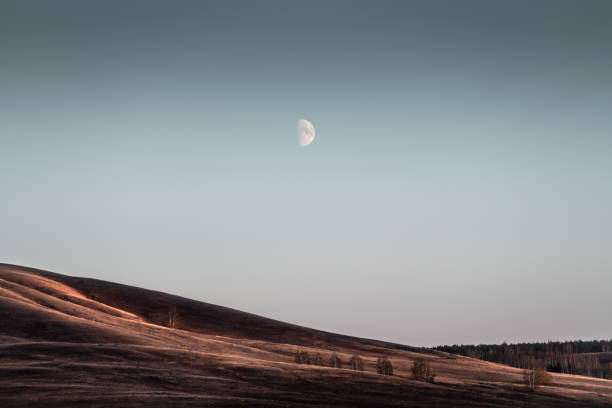 istock Moon over the autumn mountains in twilight. Abstract nature background 1436790641