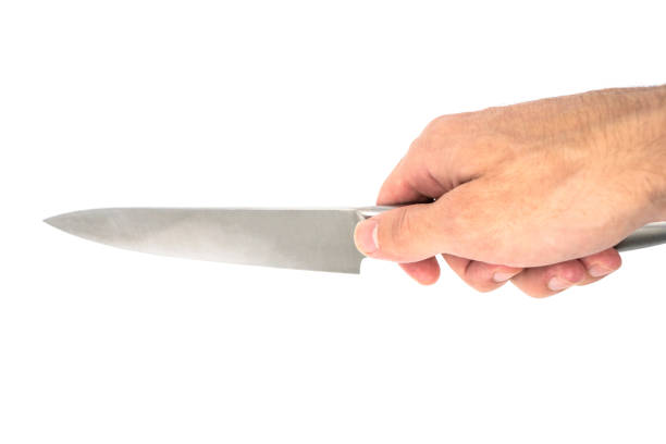 istock Kitchen knife in hand isolated on white background. Knife on a white background. 1436790955