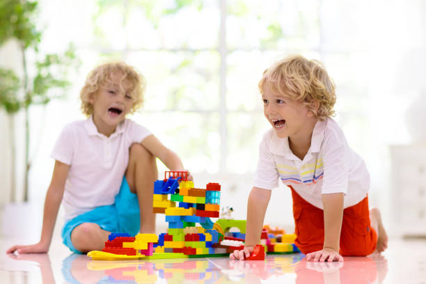 istock Child playing with toy blocks. Kids play. 1436792312