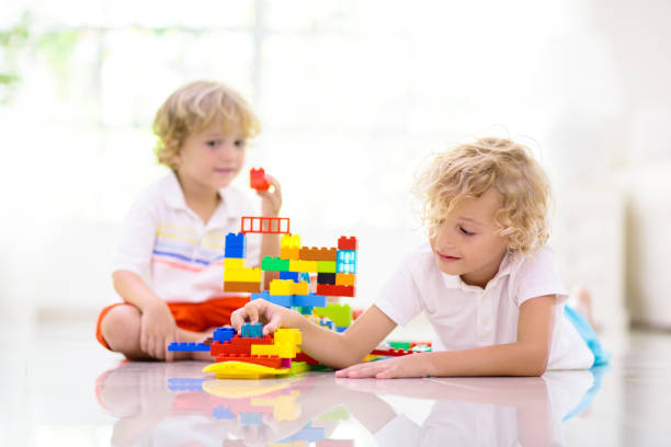 Child playing with toy blocks. Kids play. stock photo