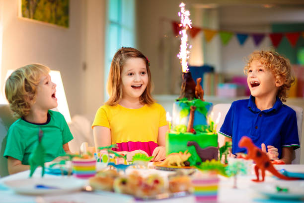 istock Kids birthday party. Dinosaur theme cake. 1436793180