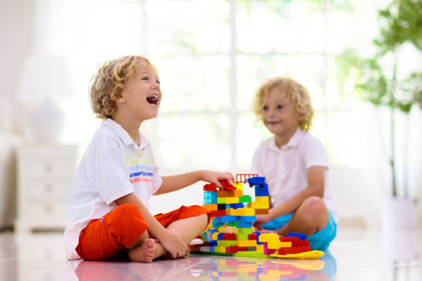 istock Child playing with toy blocks. Kids play. 1436793287