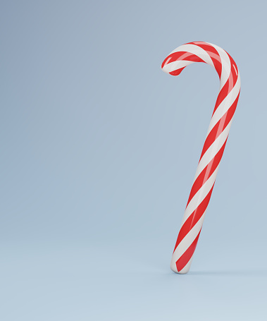 Unwrapped candy cane on white with clipping path