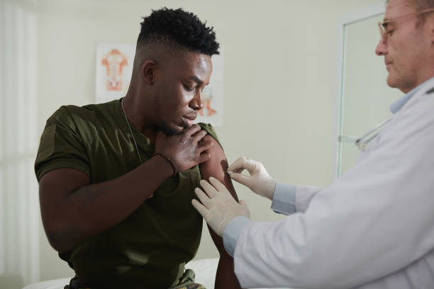 istock Doctor Injecting Vaccine 1436796765