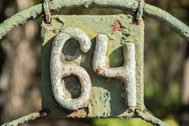 istock Old retro iron plate number 64 1436798653