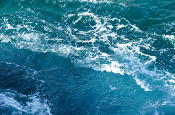 istock A foamy turquoise surface of a rough and wavy sea 1436801784