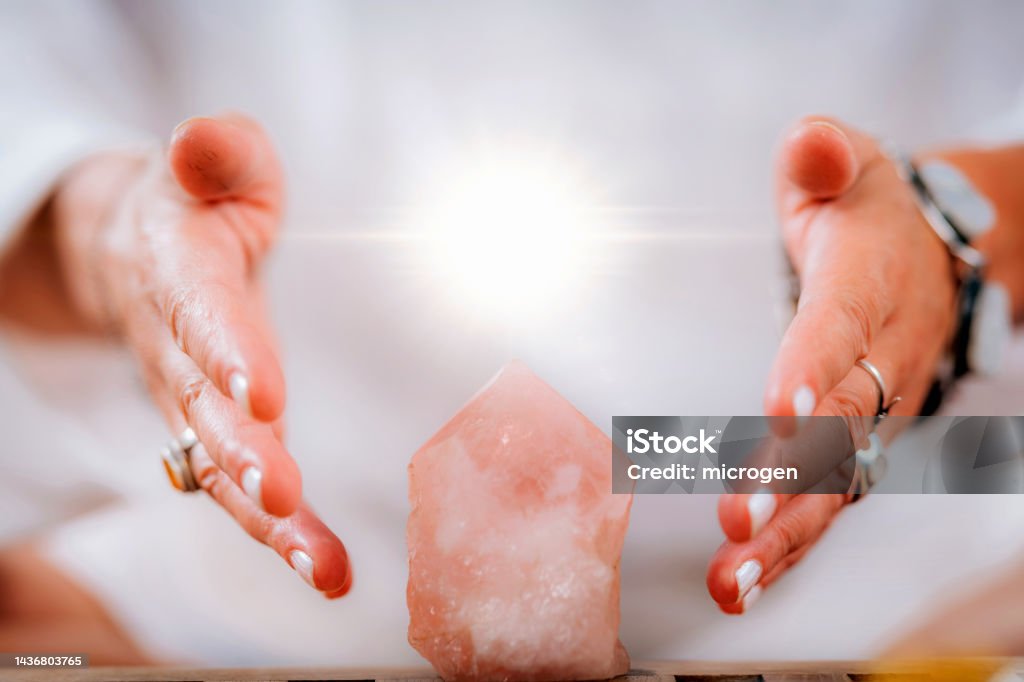 Self-Awareness Meditation Concept Self-awareness meditation concept. Emotionally aware person holding hands around energized crystal, cultivating sense of self-awareness Adults Only Stock Photo