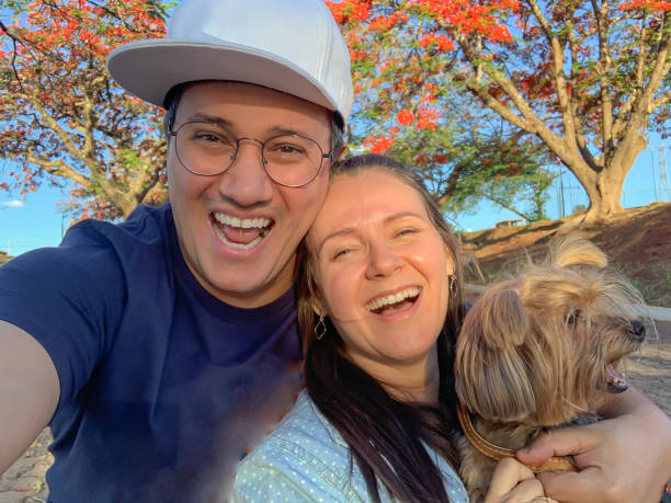 istock Happy couple with their pet 1436805696