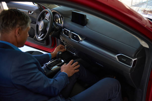 istock Male person examining red car for purchase 1436805933