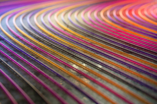 istock Colorful striped wavy lines on black background 1436807436
