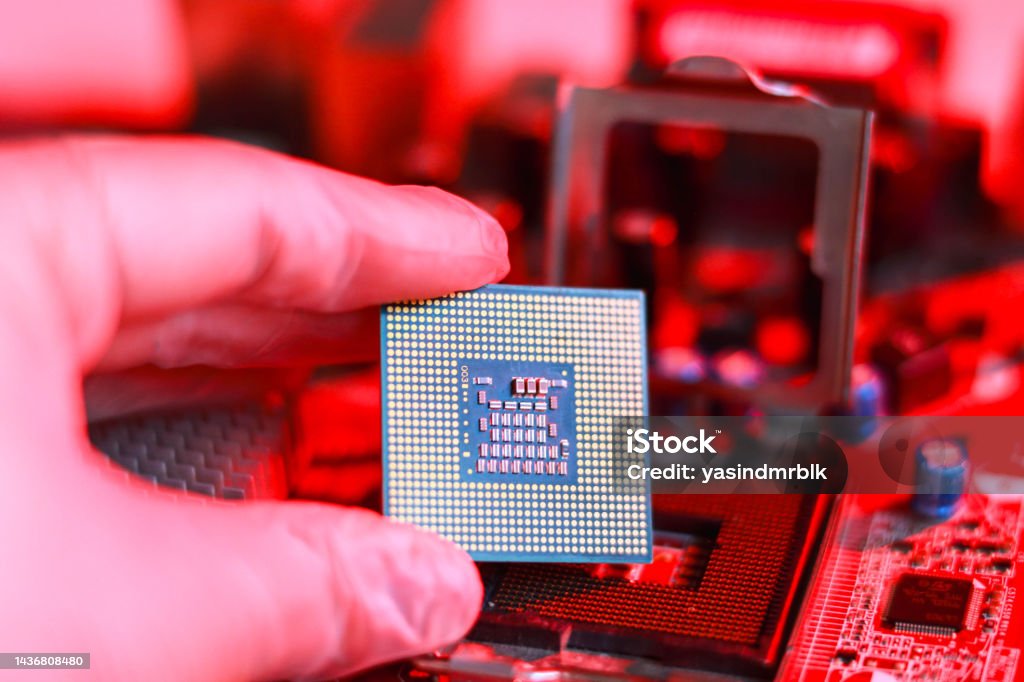 Computer Chip Installation Technician Installing Cpu Chip Microprocessor Socket On Motherboard ...