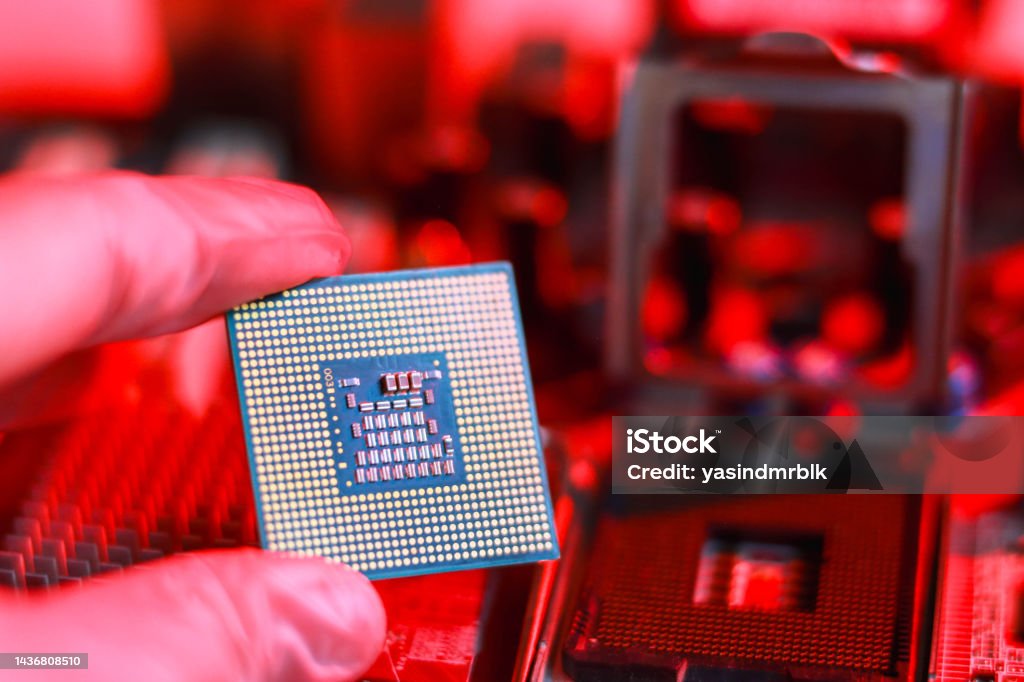 Microprocessor Socket. Shop Technician Installing Cpu Chip Microprocessor Socket On Motherboard ...