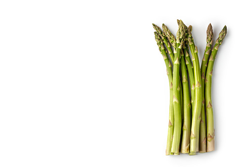 Fresh green asparagus isolated on white background. Top view, copy space, space for text. Set, group, heap.
