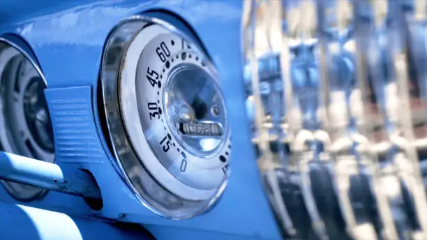 Photo of Close up Speedometer, dashboard. Action. Dashboard of a blue vintage American car