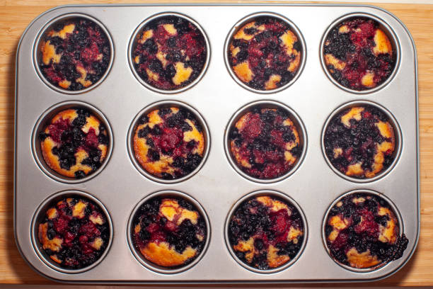 istock blueberry and raspberry muffin being baked 1436813405