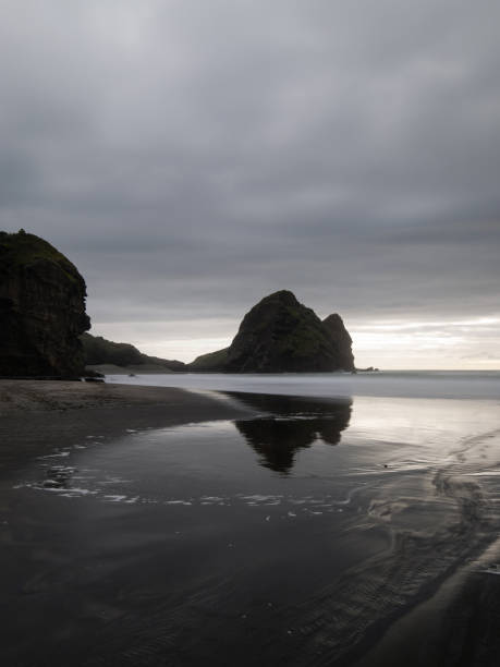 istock Taitomo Rock - Piha Beach 1436815415