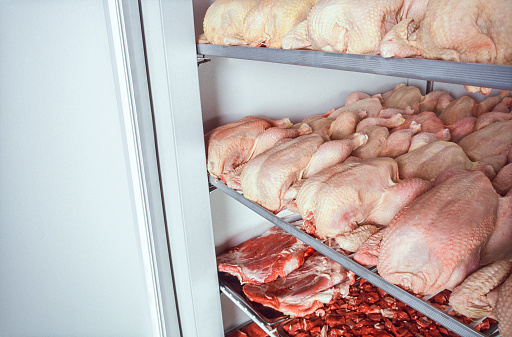 Fresh chicken and lamb meats in cold storage.