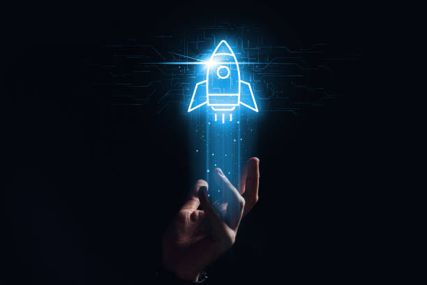 The concept of marketing and development in the form of a rocket hologram over the hand stock photo