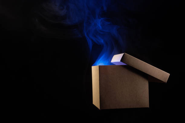 istock mysterious box opening with rays of light, mysterious gift concept 1436818720