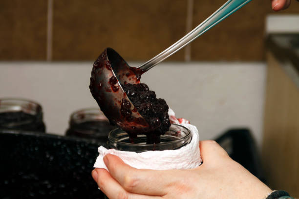 istock Process of filling jars with homemade  jam 1436819753