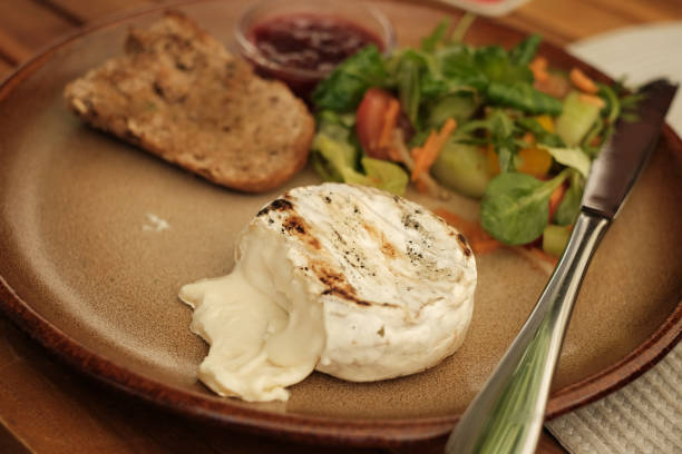 istock mediterranean culinary food dish . Grilled brie cheese or camembert cheese plate .selective focus 1436820102