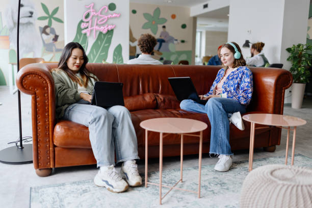 istock Creative business people working together in a office lounge area 1436821388