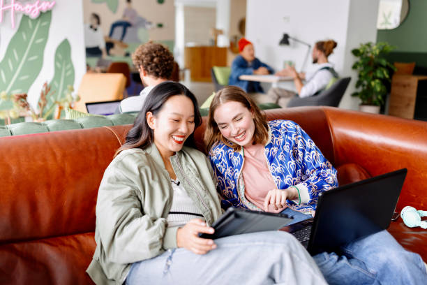 istock Two businesswomen working together in a modern office 1436821878