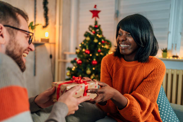 istock Man receiving a present from his girlfriend 1436822051