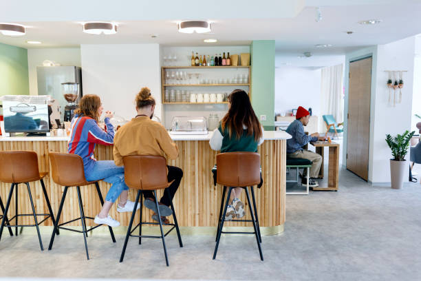 istock Gen Z coworkers taking a break at work, eating snack and chatting 1436823565