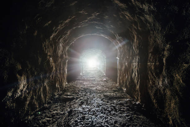 istock Dark underground tunnel. Light at the end of tunnel 1436825202