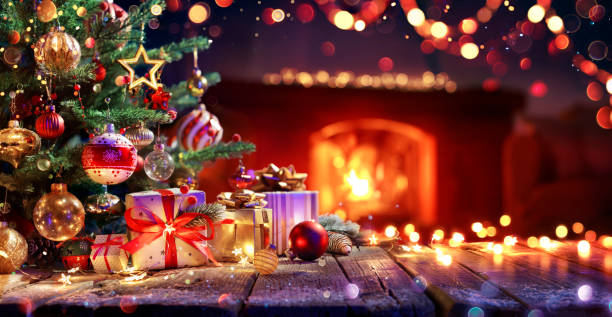 presents and christmas tree - ornament in interior with fireplace - christmas decoration fotos imagens e fotografias de stock